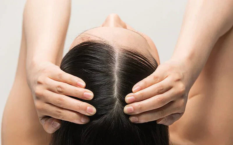 Scalp massage helps stimulate circulation, hydrate the skin, and prevent irritation during menopause.