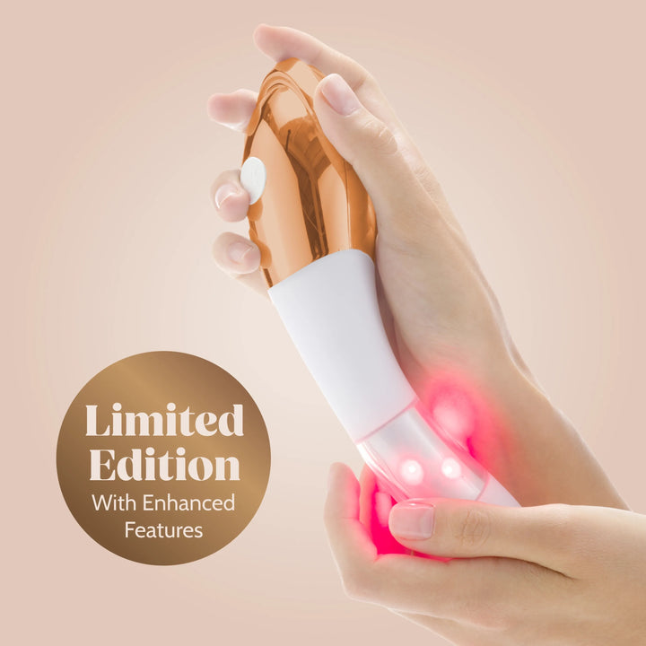 Hand holding a limited edition device with enhanced features on a beige background