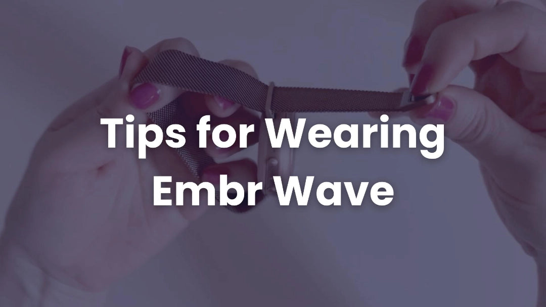 Text 'Tips for Wearing Embr Wave' over a blurred background with hands holding a hair product.