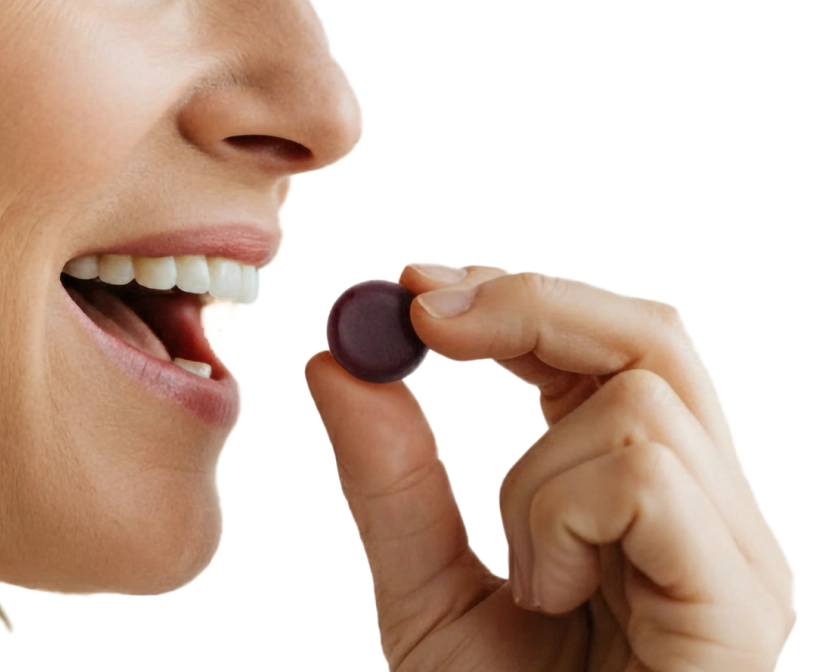 Woman enjoying tutti frutti flavored gummy supplement